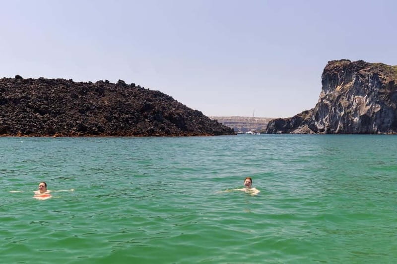 Santorini: Catamaran Cruise with Fresh Meal & Open Bar - Akrotiri Lighthouse: the southern caldera pass you remember