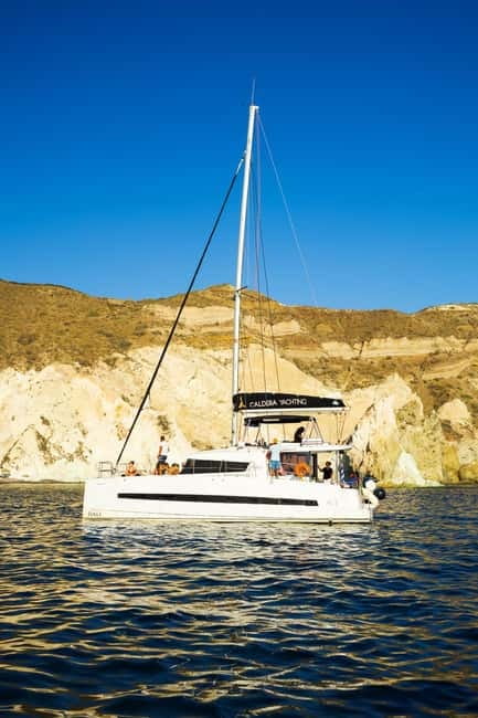 Santorini: Catamaran Cruise with Fresh Meal & Open Bar - Red Beach return at sunset, and why timing matters