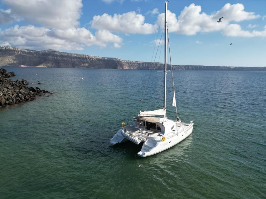 Santorini: Catamaran Cruise with Greek BBQ and Drinks - Getting to Vlychada Marina: transfers are optional, but arrive ready