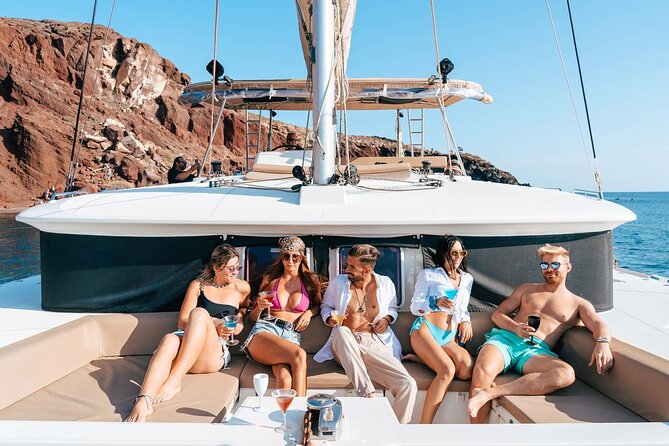 Santorini Catamaran Cruise: with Lunch, BBQ, Open Bar, Transfers - Mesa Pigadia Beach + Greek lunch: where comfort meets the water