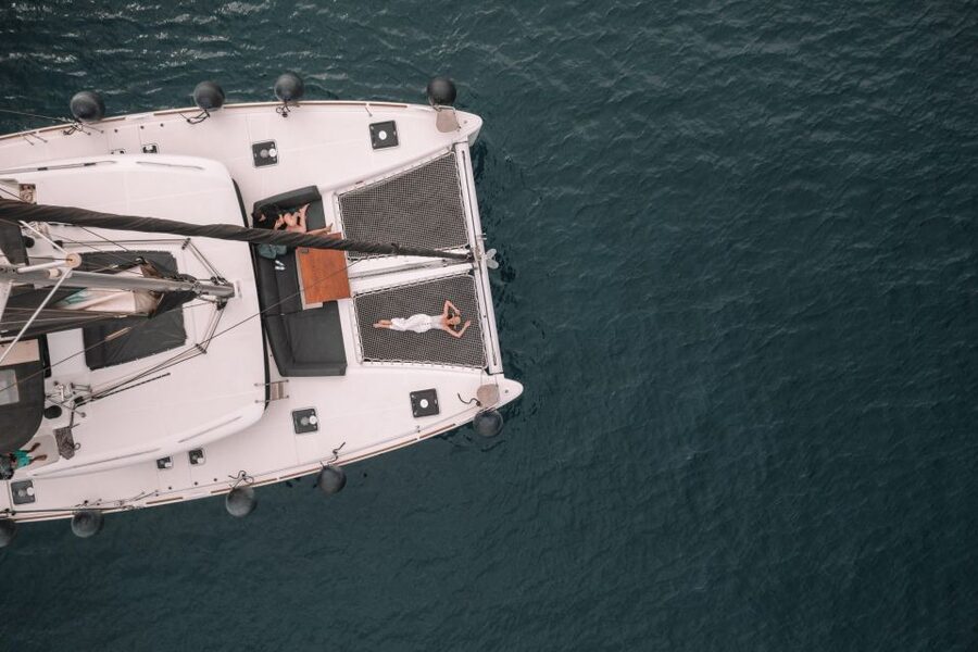 Santorini Catamaran Cruise with Swimming, Meal and Open Bar - Sailing Past White Beach and Red Beach: Your First Real Swim Stop