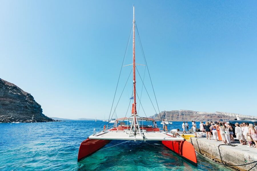 Santorini: Catamaran Tour with BBQ Dinner, Drinks, and Music - A catamaran cruise that makes Santorini feel easy