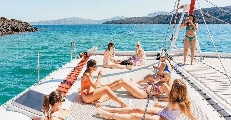 Santorini: Catamaran Tour with BBQ Dinner, Drinks, and Music - Hot springs first, then you cool off the fun way
