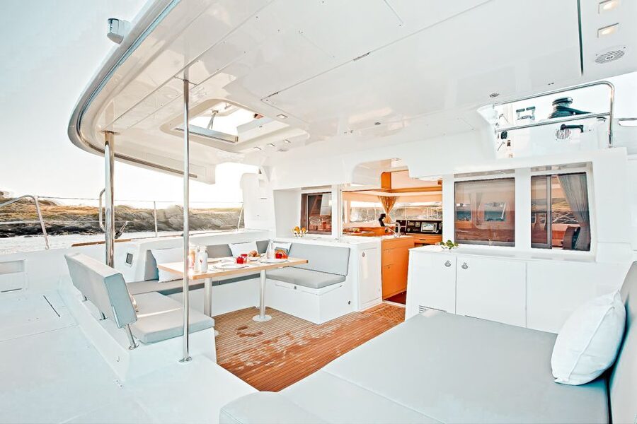 Santorini: Catamaran Tour with BBQ Meal and Unlimited Drinks - Red Beach snorkeling: fun gear, but fish sightings can vary