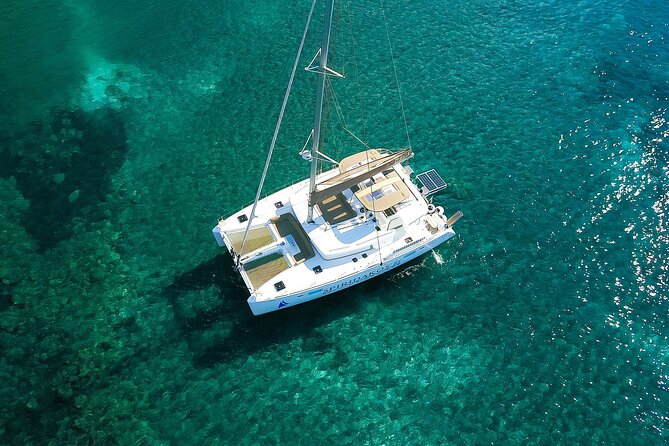 Santorini Classic Catamaran Cruise with BBQ, Drinks and Transfers - Photo stops at Red Beach and White Beach: gorgeous, but swim-free