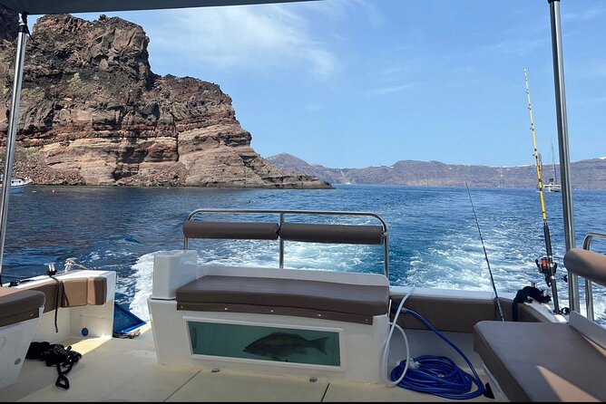 Santorini Fishing Private Cruise boat tour - BBQ, Snorkeling - Captain Makis and Elias: The Crew Who Sets the Tone