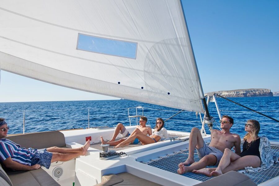 Santorini Gold Catamaran Cruise with Snorkel, BBQ & Open Bar - Volcano hot springs: warm water, sulfur smell, and real history talk