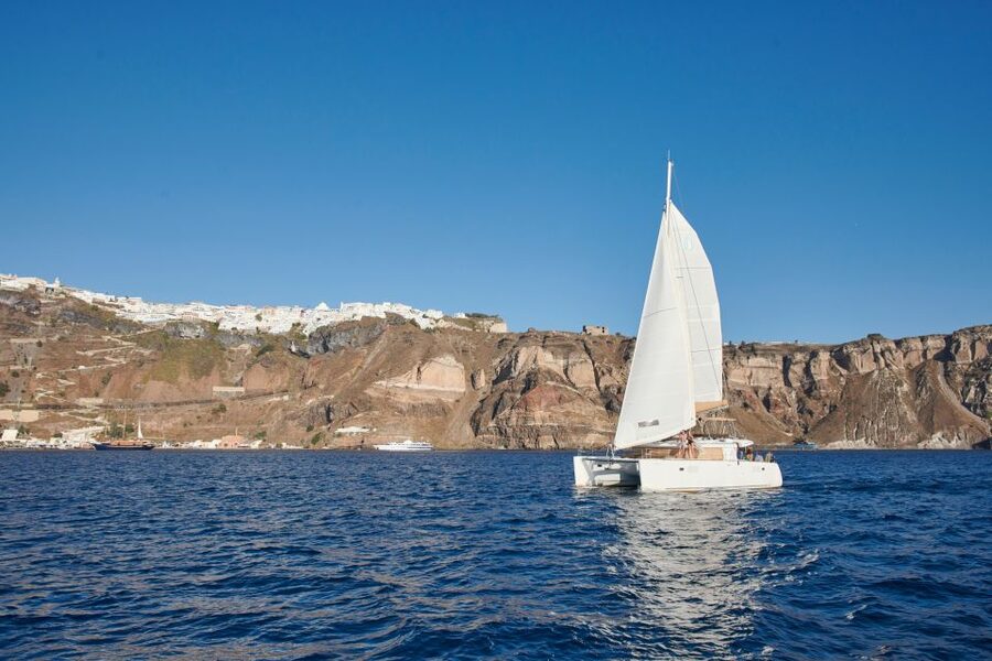 Santorini Gold Catamaran Cruise with Snorkel, BBQ & Open Bar - Cliffside villages from the sea: how the caldera finally clicks