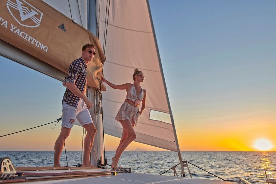 Santorini Gold Catamaran Cruise with Snorkel, BBQ & Open Bar - Open bar flow, onboard music, and the mood factor