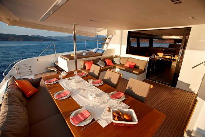 Santorini Luxury Catamaran Day Cruise with BBQ,drinks,transfer - Red Beach: Short, Scenic, and Great for a Second Swim