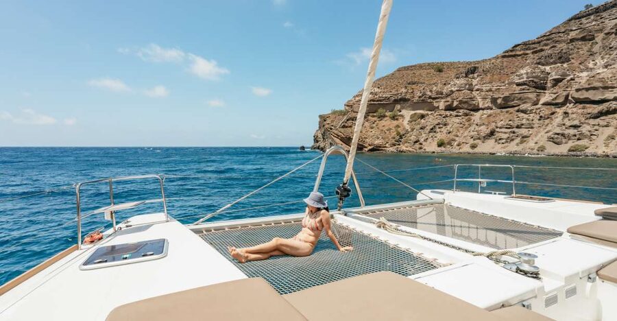 Santorini: Luxury Catamaran Day Trip with Meal and Open Bar - Getting There Smoothly, Then Settling In on a Small Boat