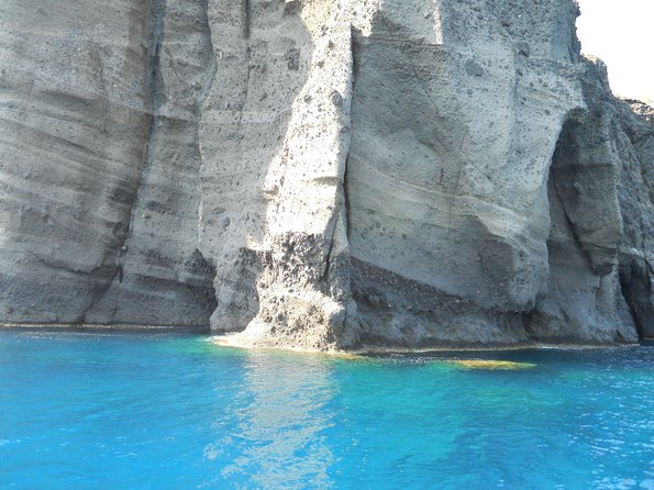 Santorini Luxury Catamaran Sunset Cruise with BBQ, Drink and Transfer - Red Beach Snorkeling: Short Swim, Big Color