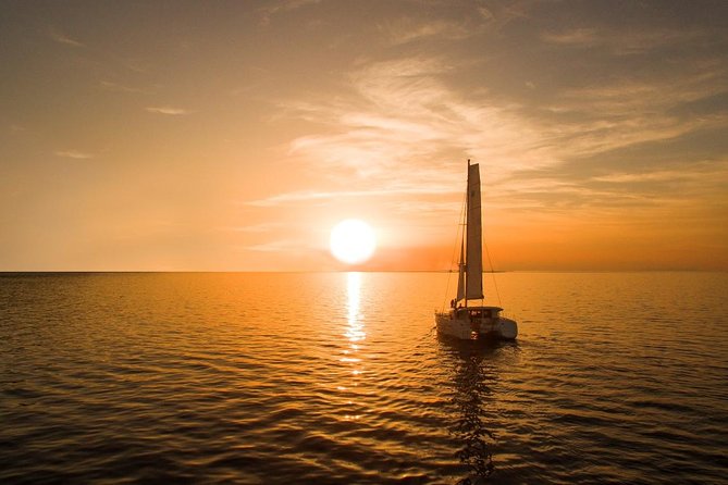 Santorini Luxury Catamaran Sunset Cruise with BBQ, Drink and Transfer - White Beach + Board BBQ: Where the Day Starts to Feel Like a Party