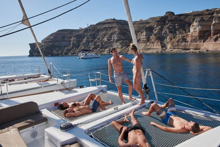 Santorini: Platinum Catamaran Cruise w/ BBQ Meal & Open Bar - Sunset from the catamaran: why it feels calmer than the shore scene