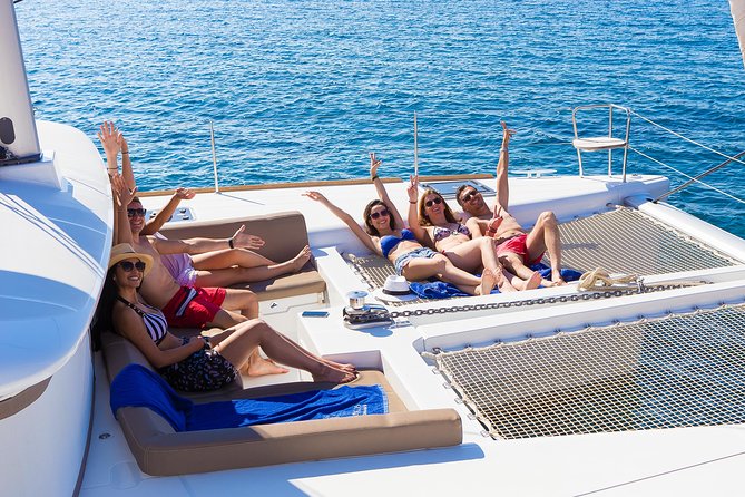 Santorini Private Catamaran Cruise with BBQ, Open Bar & Transfers - Red Beach for photos and a first hit of Santorini color