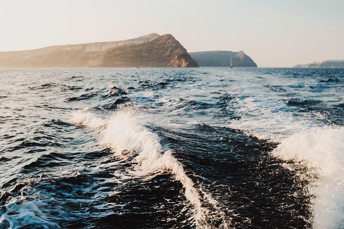 Santorini Private Catamaran Cruise with BBQ, Open Bar & Transfers - Indian Rocks and the caldera viewpoint from sea level