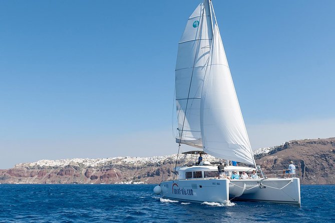 Santorini Small-Group Catamaran Sailing Trip(BBQ,drinks, transfer) - Red Beach Swim Stop: Volcanic Color Meets Real Water Time