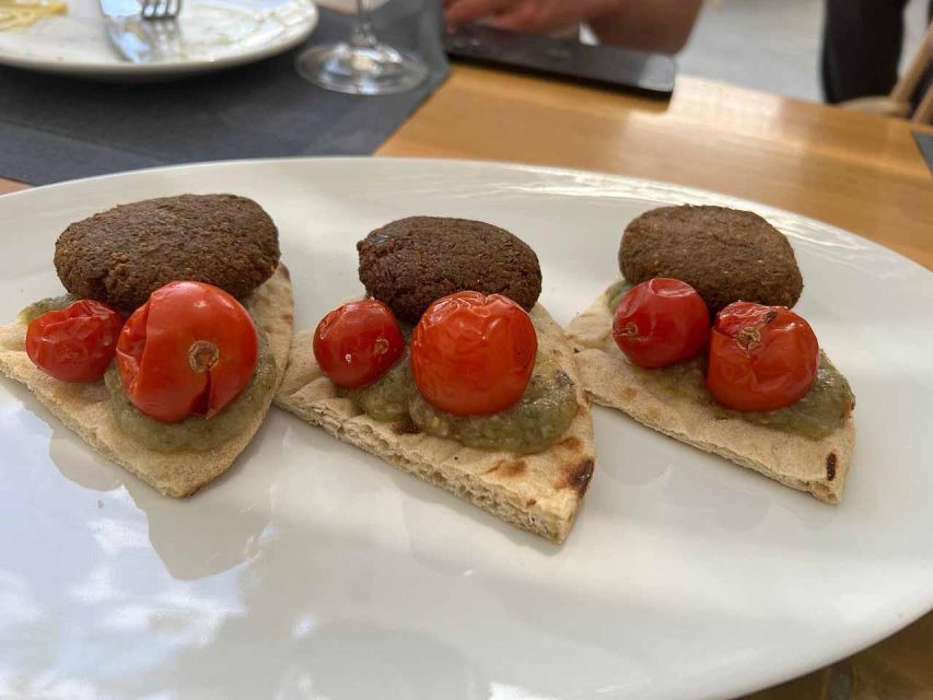 Santorini: Small-Group Sunset Wine Tour with Santo Winery - The cellars and wine-field walk: why the tour is more than sipping