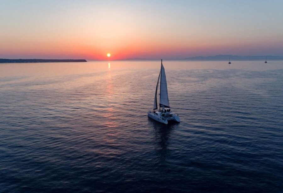 Santorini: Sunset Cruise with Swim Stops, Dinner, and Drinks - Snorkeling in the Aegean: Gear Included, Expect Fish and Freedom