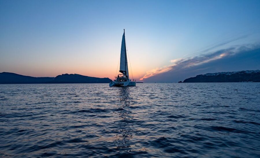 Santorini: Sunset Cruise with Swim Stops, Dinner, and Drinks - Dinner and Drinks at Sea: Greek Mezzes, BBQ, and Vegetarian Options