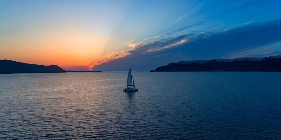 Santorini: Sunset Cruise with Swim Stops, Dinner, and Drinks - The Hot Springs Stop: Therapeutic Water, Real-World Temperatures