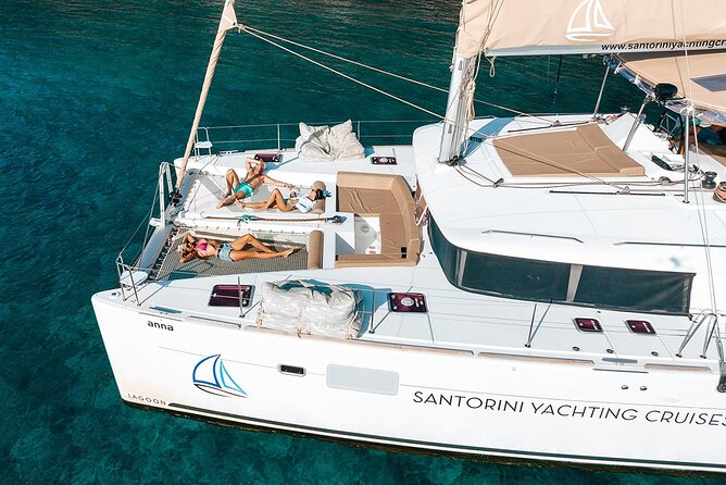 Santorini Sunset Sailing Cruise: Dinner, BBQ, Open Bar, Transfers - Red Beach (About 1 Hour): The Quick Hit of Color, Sun, and a Real Swim