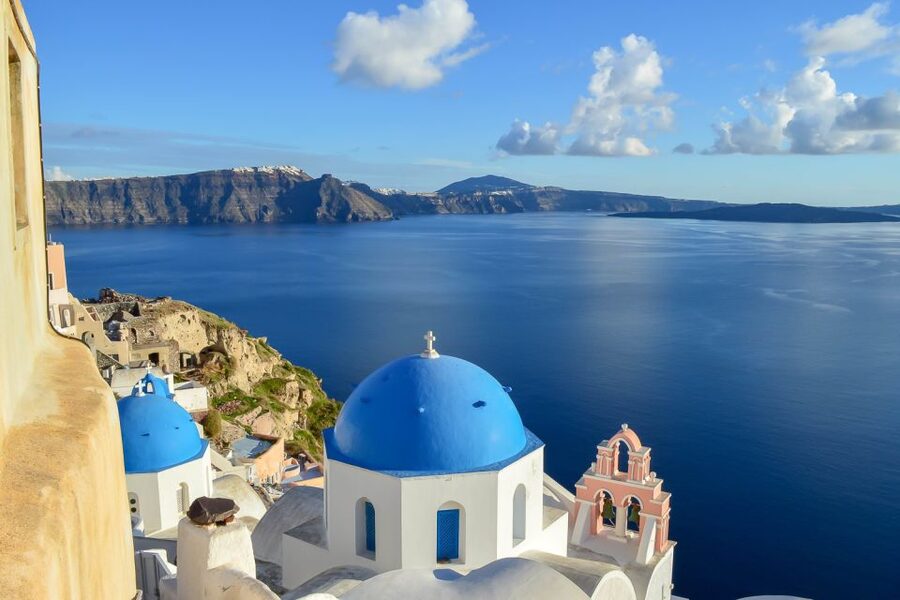 Santorini: Traditional Sightseeing Bus Tour with Oia Sunset - Emporio village, windmills, and the slower pace before the beach