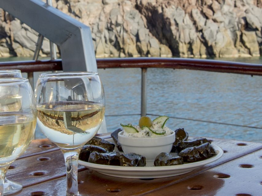Santorini: Traditional Wooden Boat Tour with Meal and Wine - Volcano hot springs, geothermal swimming, and the calm of doing it by boat