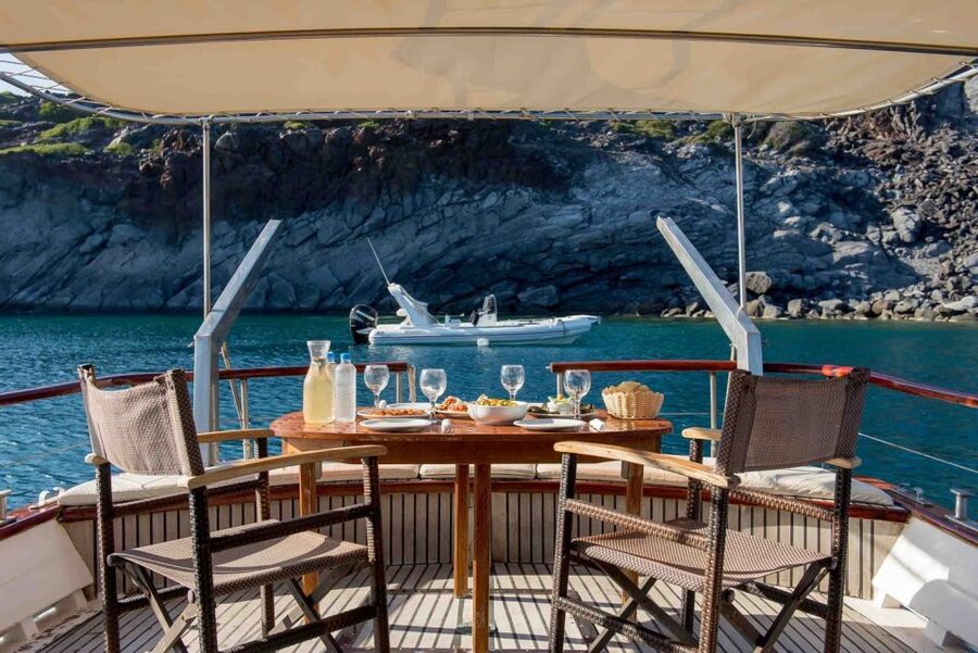 Santorini: Traditional Wooden Boat Tour with Meal and Wine - Thirassia Island snorkeling, and why this stop feels quieter than the main towns