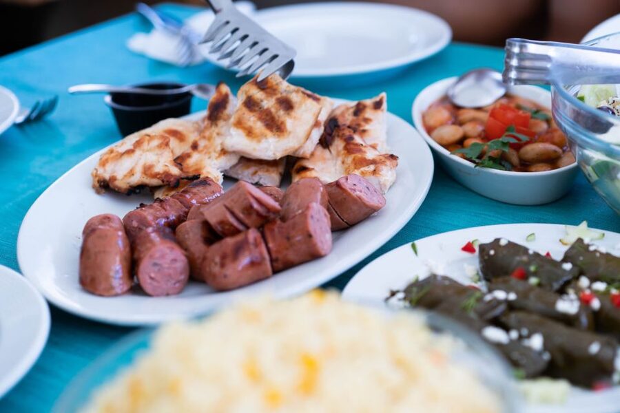 Santorini: Traditional Wooden Boat Tour with Meal and Wine - Ammoudi and your Greek lunch or dinner, how the meal actually fits the day