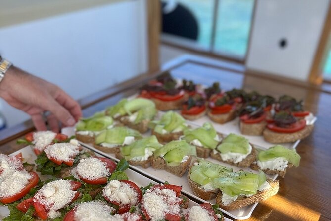 Small Group Kaiki Cruise & Greek Gastronomy Experience - Panteronisi, the Blue Lagoon finale: swim last, snack after
