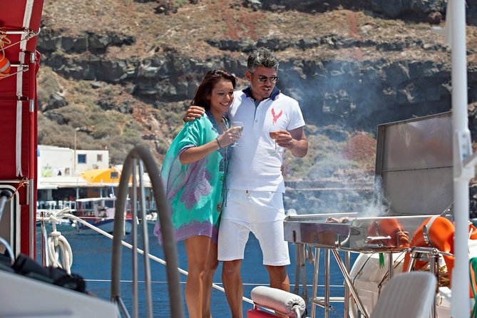 Sunset Sailing Catamaran Cruise in Santorini with BBQ and Drinks - Hotel Pickup, Timing, and a 5-Hour Sea Loop