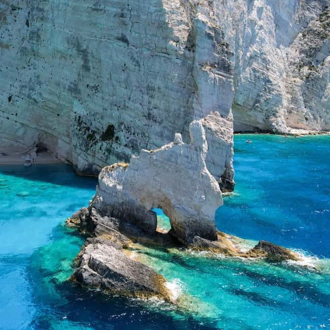 Zakinthos: Shipwreck Beach and Blue Caves Land and Sea Tour - Makris Gialos Beach Photo Stop: Rocky Shore Views Before the Main Event