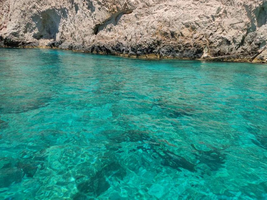 Zakynthos: Turtle Island and Caves Private Boat Trip - Stop 1 at Agios Sostis: cruising, photos, and early marine watching